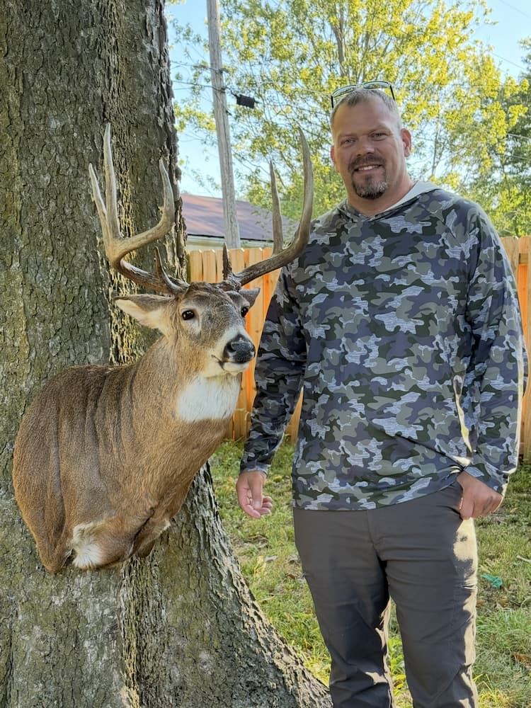 Happy customer with mounted deer