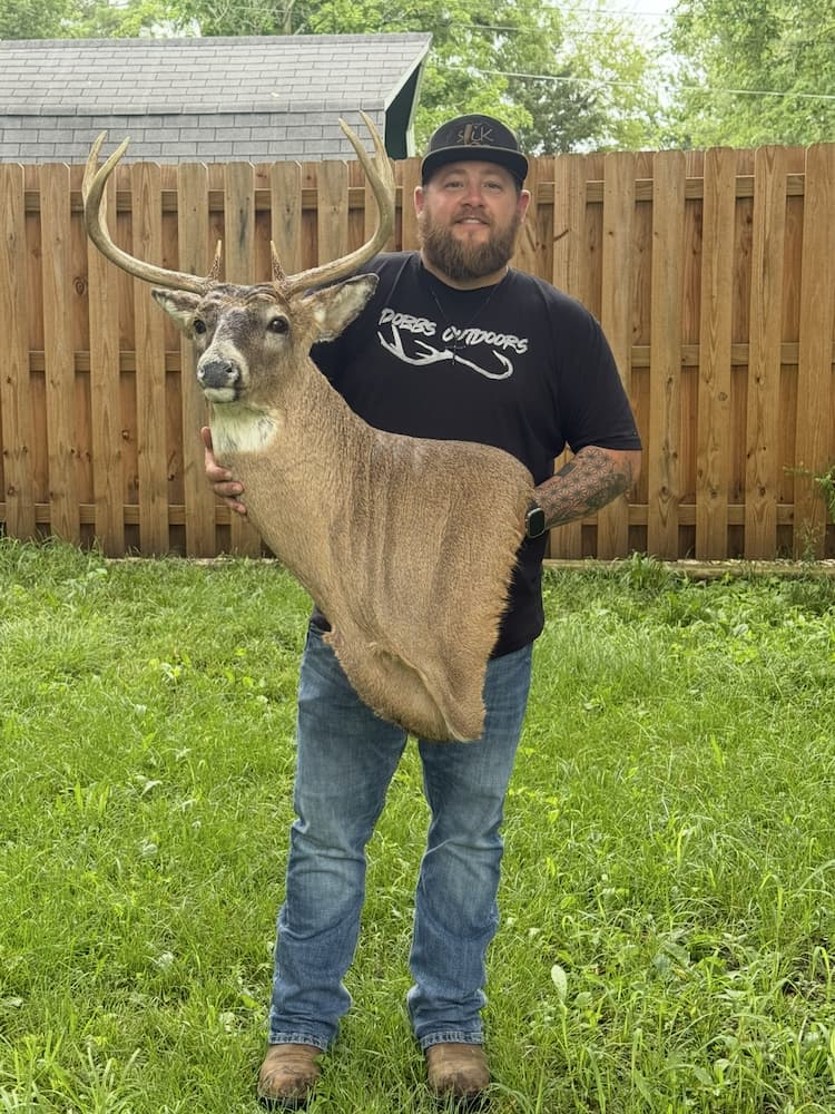 Customer holding whitetail mount